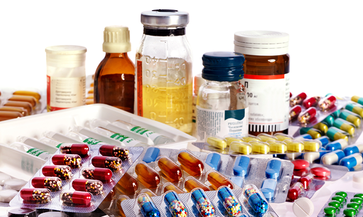 A variety of medicine in bottles and pill form