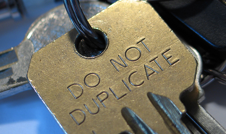 A gold key with 'DO NOT DUPLICATE' written on it