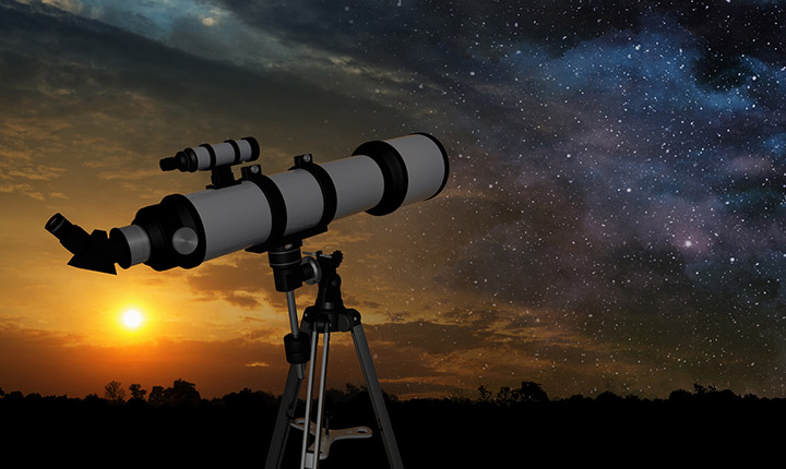 Telescope pointed towards a night sky