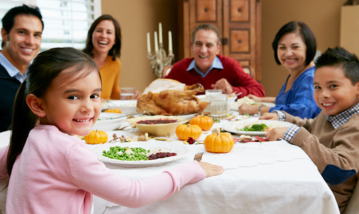 Family gathered around a table for a meal