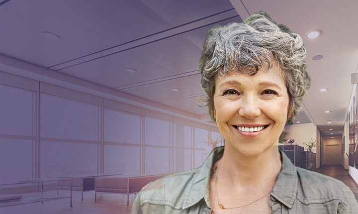 Head shot of middle aged woman overlayed on background image of office space